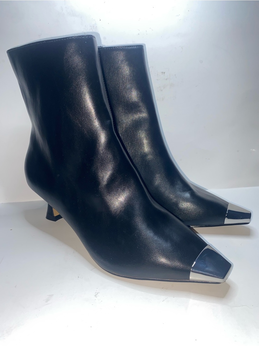 Adrienne Vittadini Black Leather Ankle Boots with Silver Cap Toe display
